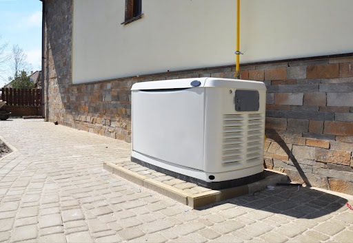 A standby generator installed outside of a building.