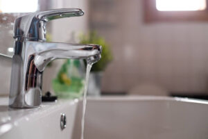 Broken faucet leaking water.